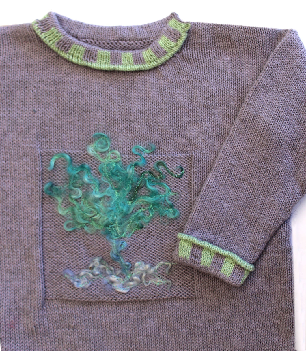 Opskrift Karen Noe Sweater med motiv af farvede uldtops